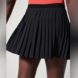 Spanx get moving pleaded skirt SZ Medium (runs small)